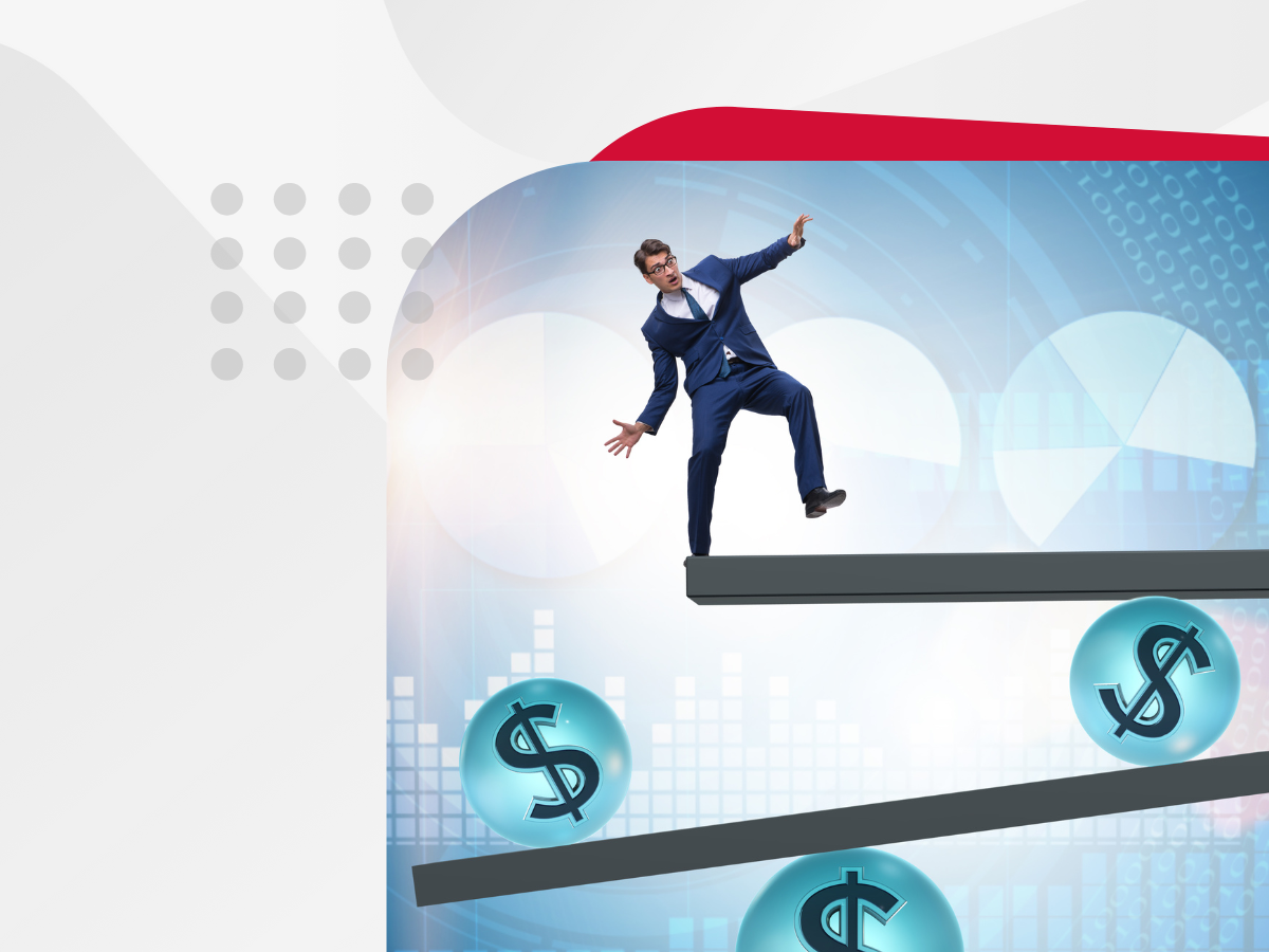 A man in a suit balancing on a balance beam with dollar signs in the background.